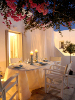 Outdoor dining by night, Kapetan Tasos Suites, Pollonia, Milos, Cyclades, Greece