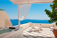 Honeymoon Suite veranda with outdoor Jacuzzi tub at Canaves Oia Suites, Oia, Santorini