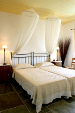 A Superior suite bedroom, A Superior suite bedroom at Niriedes Suites, Platy Yialos, Sifnos