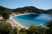 Hotel sun beds on the beach of Panormos Bay, Blue Green Bay,  Skopelos, Sporades, Greece