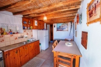 The kitchen and dining area of the annex house of the Aera Milos Windmill, Tripiti, Milos