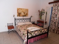 Bedroom of an apartment at Glaronissia Hotel, Milos