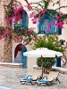 Sun beds at pool area, The Aegean Plaza Hotel, Kamari, Santorini, Cyclades, Greece