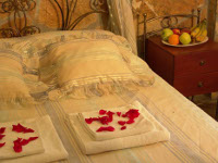 A bedroom décor in Vassilia Rooms & Suites, Livadakia, Serifos
