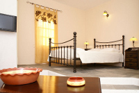 A studio bedroom of Mare Nostrum Apartments, Kamares, Sifnos