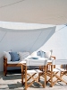 A shaded outdoor veranda lounge, Elies Resorts Hotel, Vathi, Sifnos, Cyclades, Greece