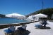 Sun bed patio overlooking the pier of Vathi and the Monastery of Taxiarchis , Virginia Studios, Vathi, Sifnos, Cyclades, Greece