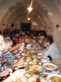 People eating at a traditional festival in Sifnos