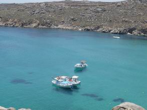 Excursion boats at Super Paradise Beach in Mykonos, Greece